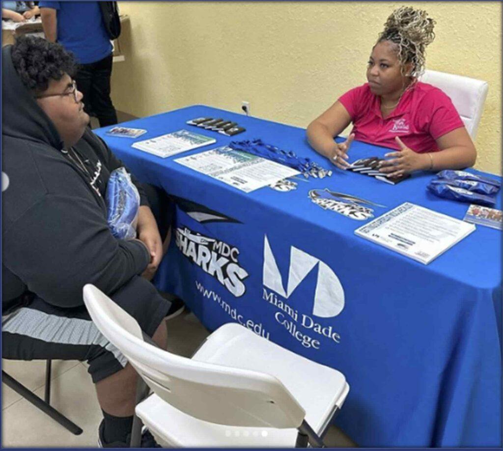 Students at a Miami Dade College information table